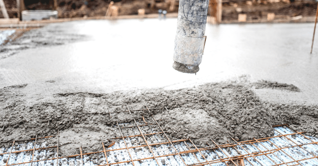 close up of steel mesh being filled with concrete 